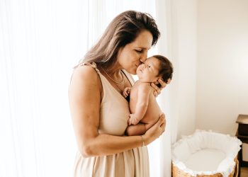 woman in white tank top kissing woman in white tank dress